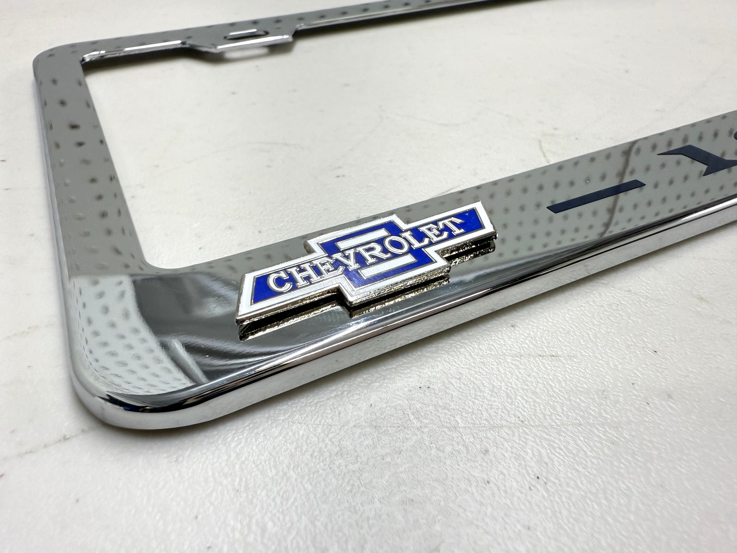1962 CHEVROLET IMPALA, BEL AIR, BISCAYNE CHROME LICENSE PLATE FRAME WITH DUAL CHEVY BOWTIE LOGOS (2 HOLES)