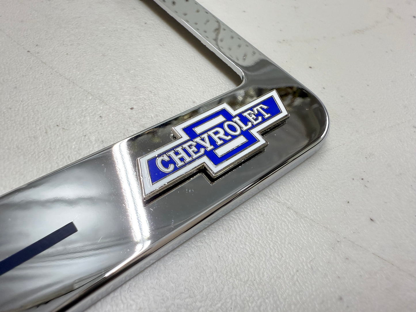 1964 CHEVROLET IMPALA, BEL AIR, BISCAYNE CHROME LICENSE PLATE FRAME WITH DUAL CHEVY BOWTIE LOGOS (2 HOLES)