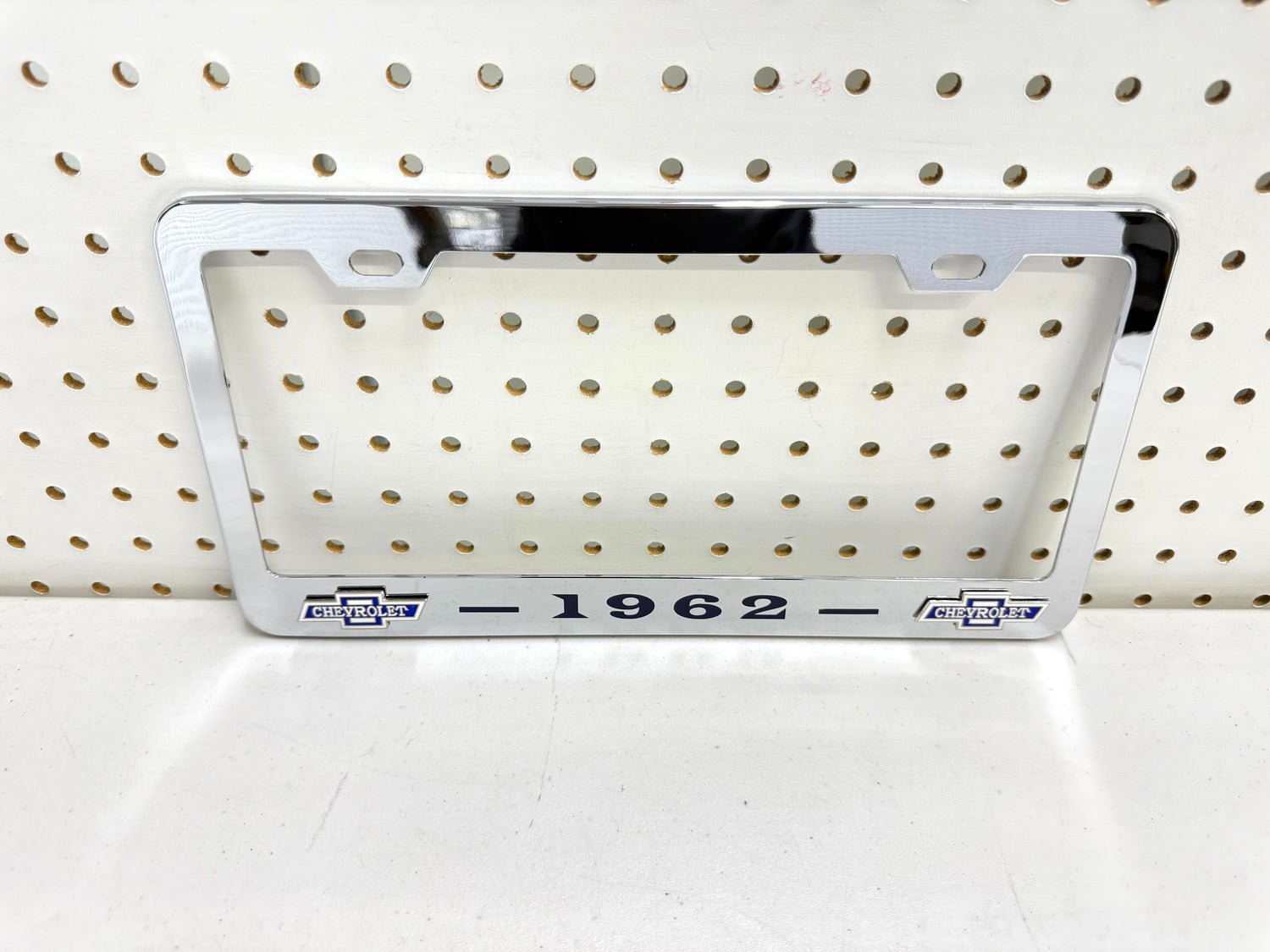 1962 CHEVROLET IMPALA, BEL AIR, BISCAYNE CHROME LICENSE PLATE FRAME WITH DUAL CHEVY BOWTIE LOGOS (2 HOLES)