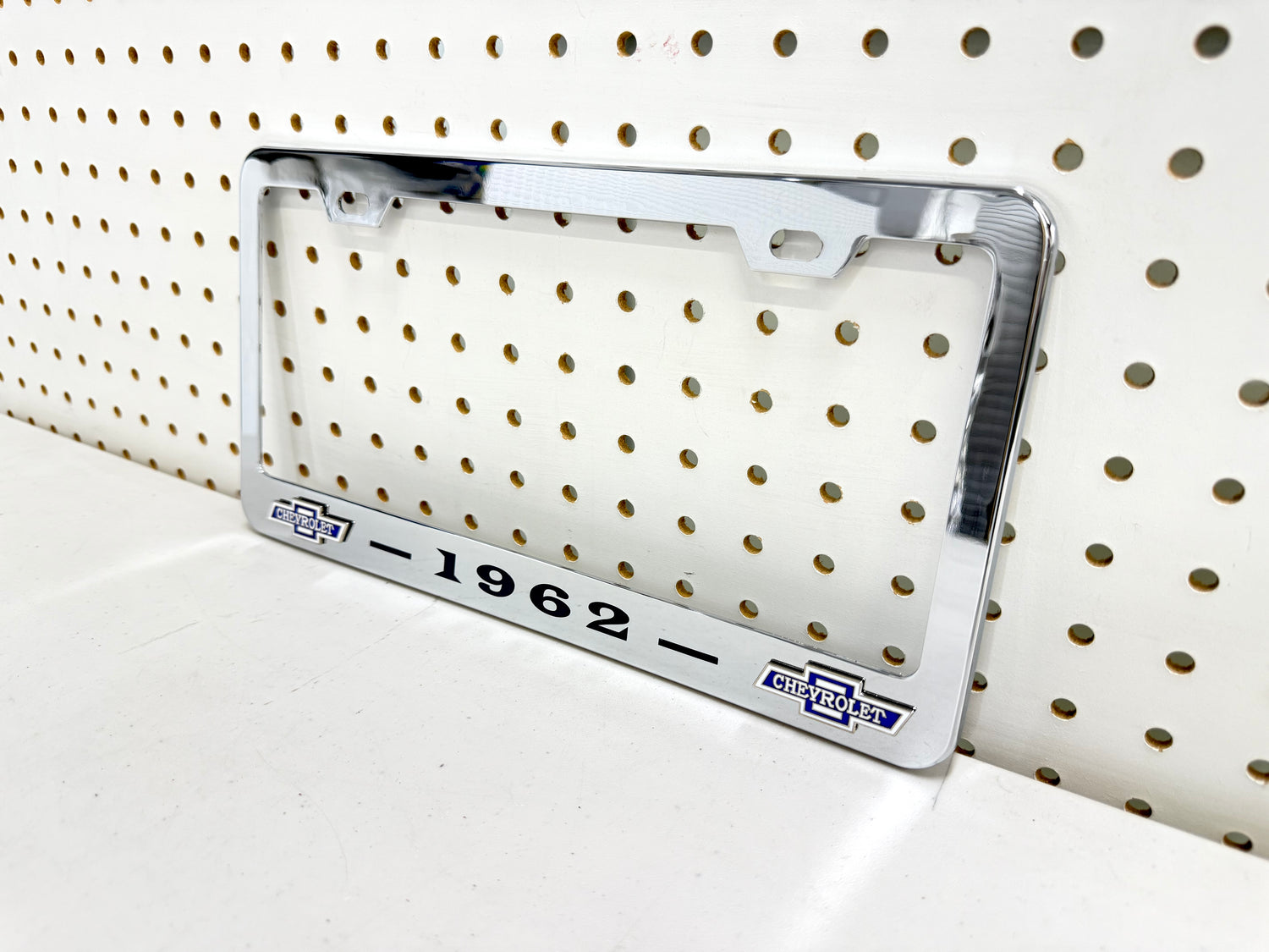 1962 CHEVROLET IMPALA, BEL AIR, BISCAYNE CHROME LICENSE PLATE FRAME WITH DUAL CHEVY BOWTIE LOGOS (2 HOLES)