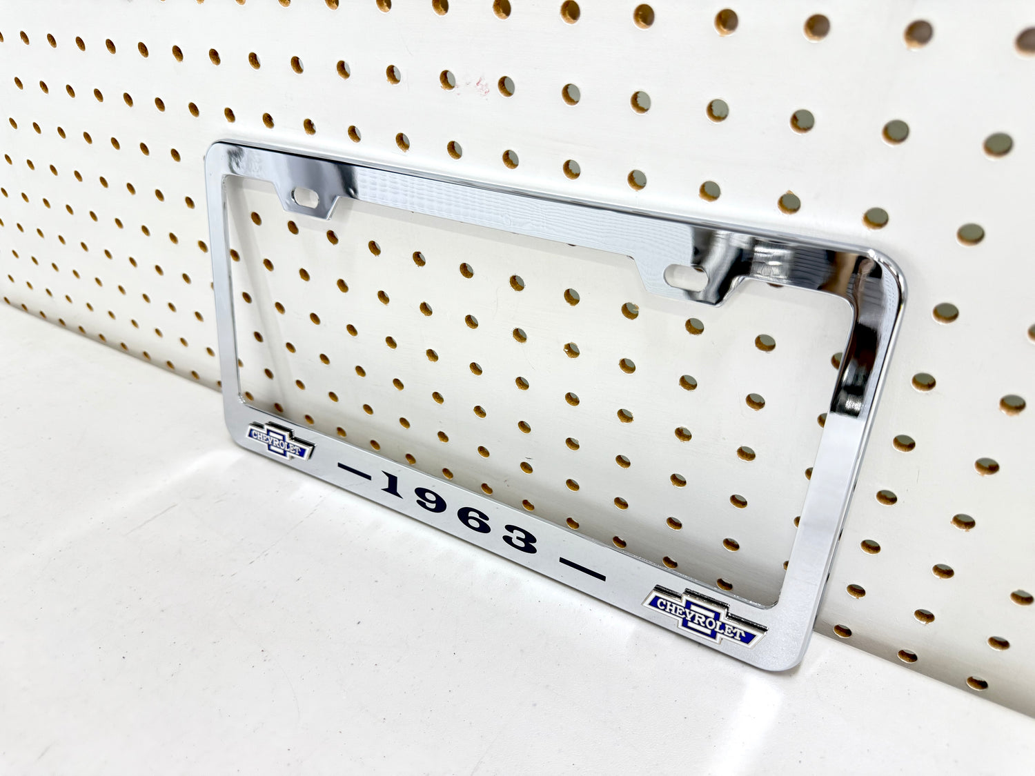 1963 CHEVROLET IMPALA, BEL AIR, BISCAYNE CHROME LICENSE PLATE FRAME WITH DUAL CHEVY BOWTIE LOGOS (2 HOLES)