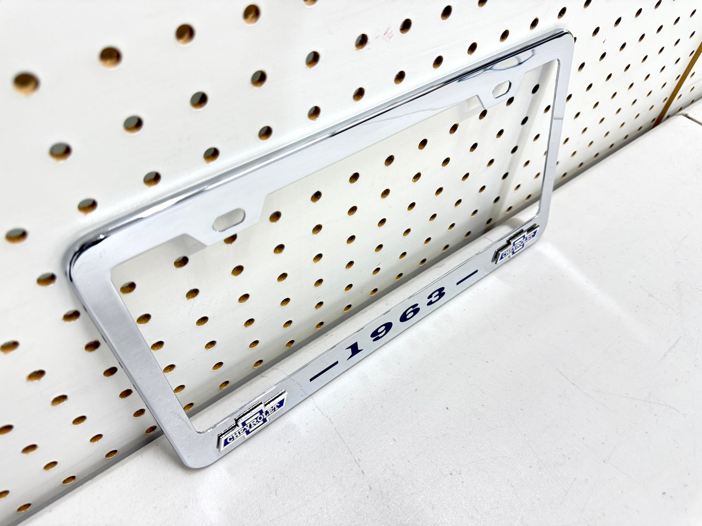 1963 CHEVROLET IMPALA, BEL AIR, BISCAYNE CHROME LICENSE PLATE FRAME WITH DUAL CHEVY BOWTIE LOGOS (2 HOLES)
