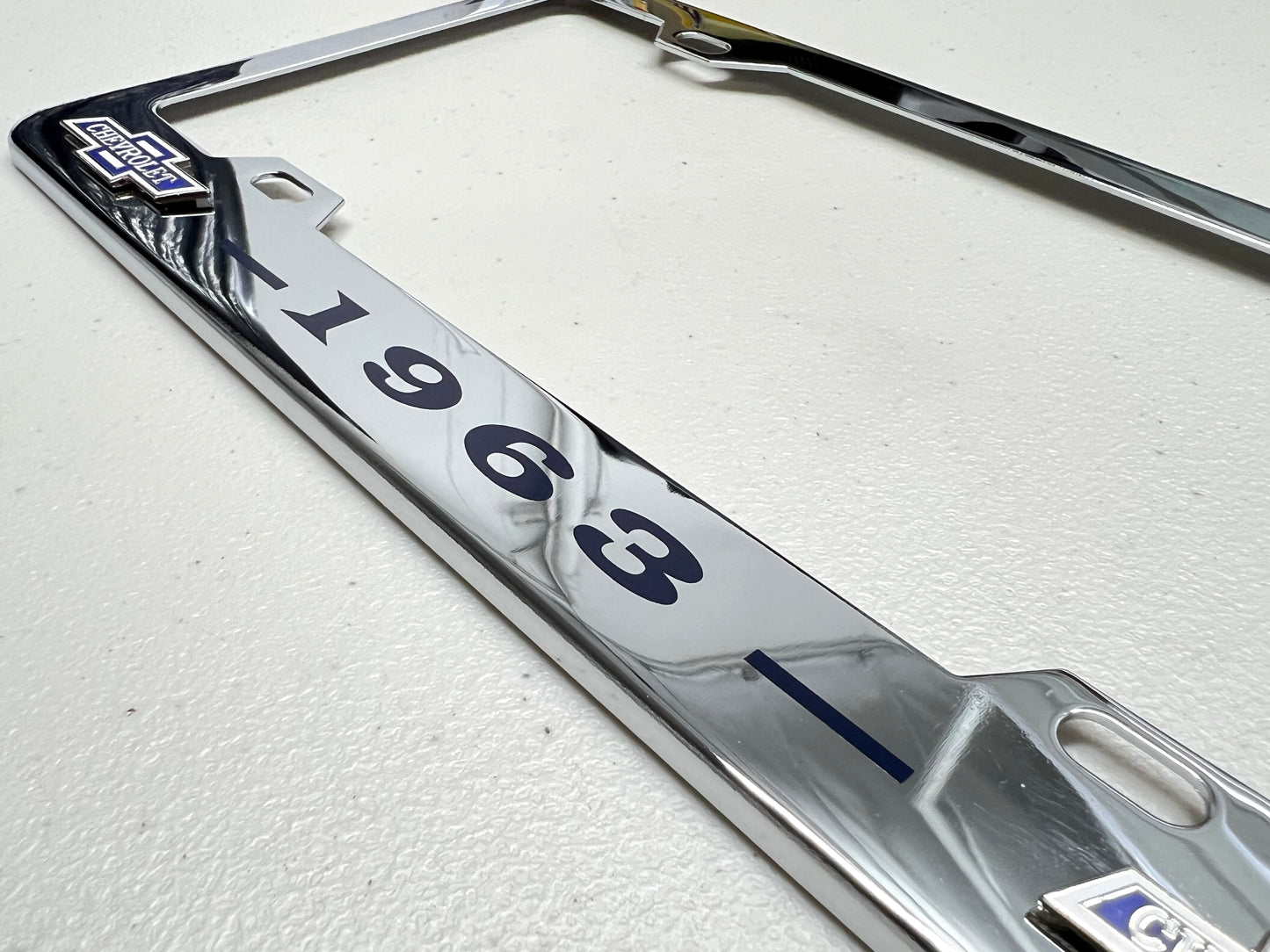 1963 CHEVROLET IMPALA, BEL AIR, BISCAYNE CHROME LICENSE PLATE FRAME WITH DUAL BOWTIE LOGOS