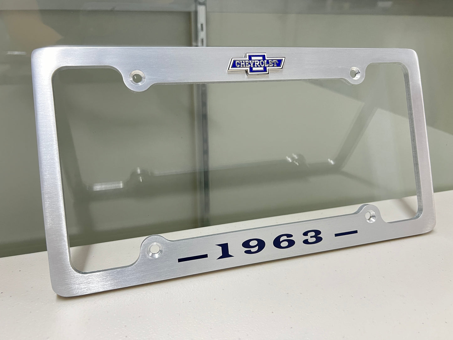 1963 CHEVROLET IMPALA, BEL AIR, BISCAYNE BRUSHED ALUMINUM LICENSE PLATE FRAME WITH BOWTIE LOGO