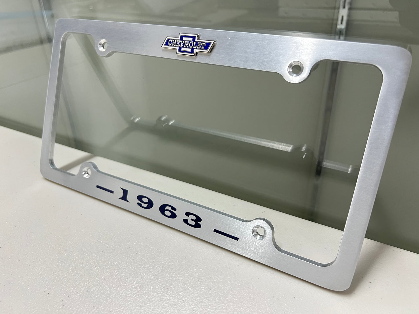 1963 CHEVROLET IMPALA, BEL AIR, BISCAYNE BRUSHED ALUMINUM LICENSE PLATE FRAME WITH BOWTIE LOGO