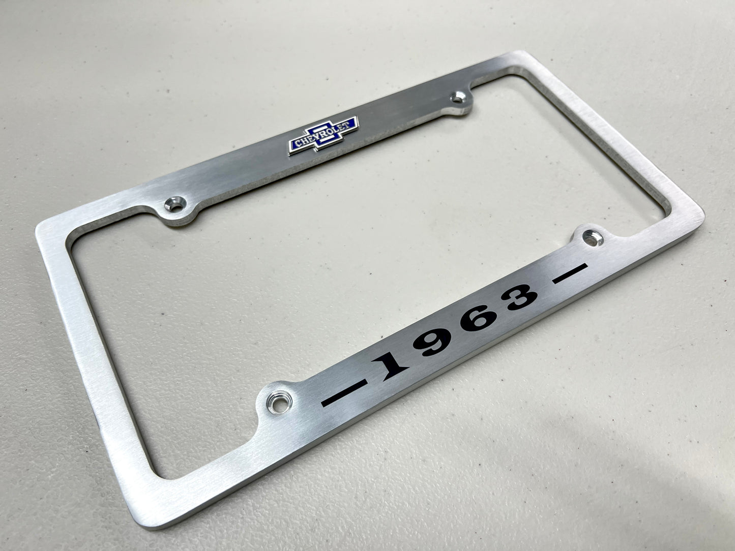 1963 CHEVROLET IMPALA, BEL AIR, BISCAYNE BRUSHED ALUMINUM LICENSE PLATE FRAME WITH BOWTIE LOGO