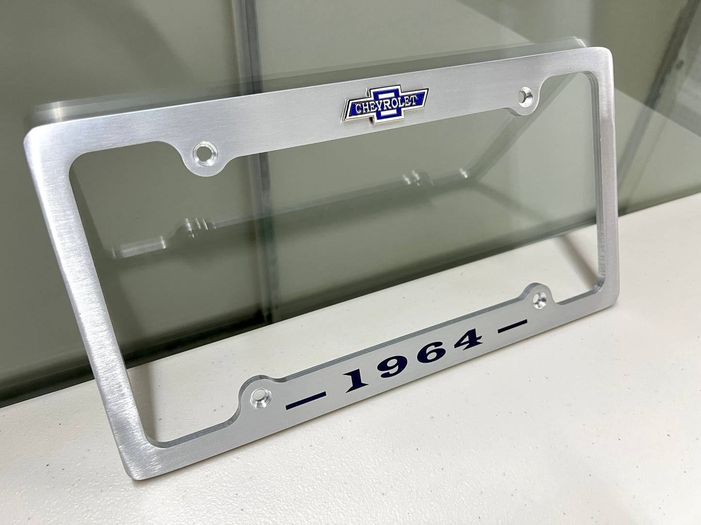 1964 CHEVROLET IMPALA, BEL AIR, BISCAYNE BRUSHED ALUMINUM LICENSE PLATE FRAME WITH BOWTIE LOGO