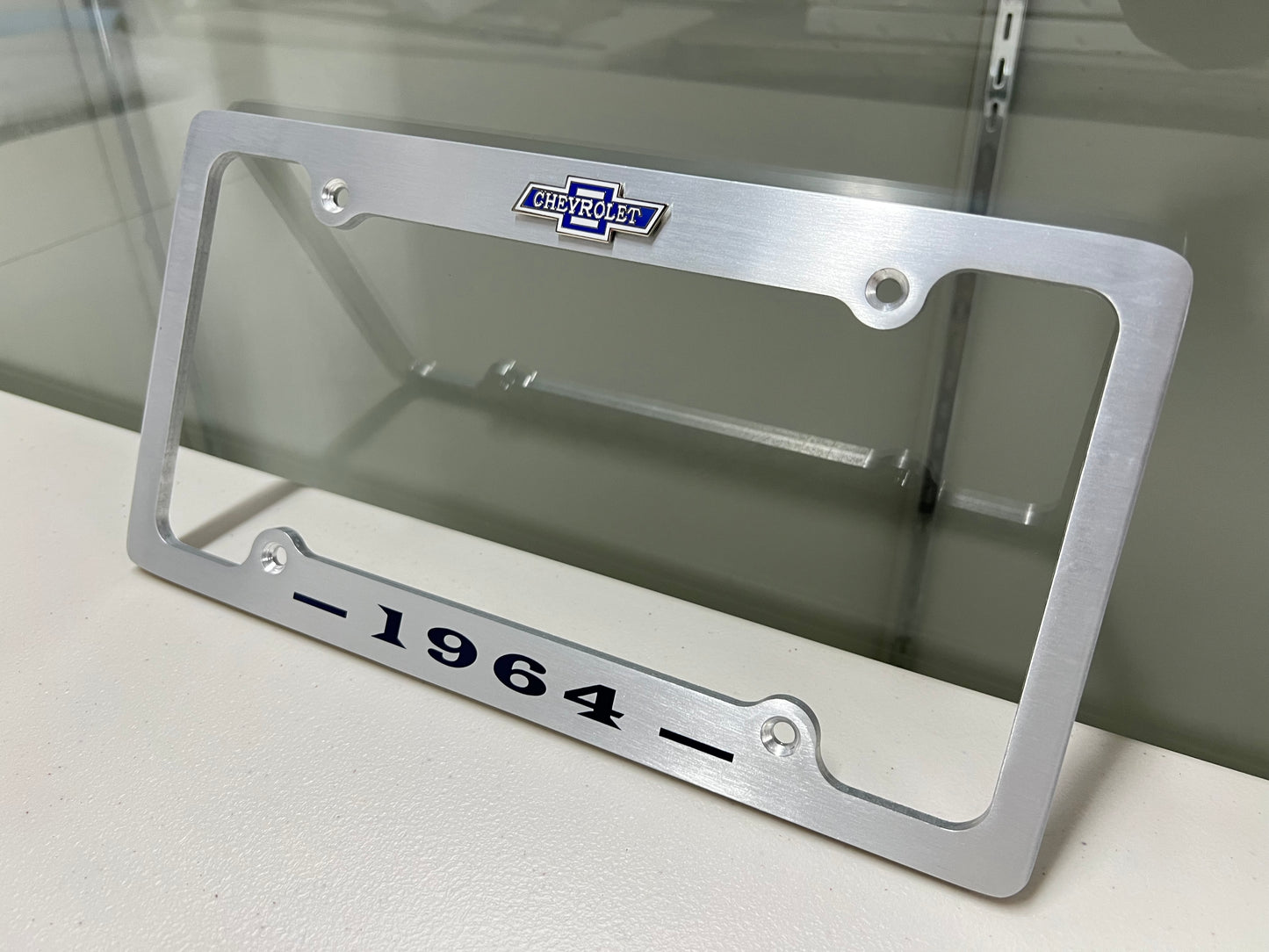 1964 CHEVROLET IMPALA, BEL AIR, BISCAYNE BRUSHED ALUMINUM LICENSE PLATE FRAME WITH BOWTIE LOGO