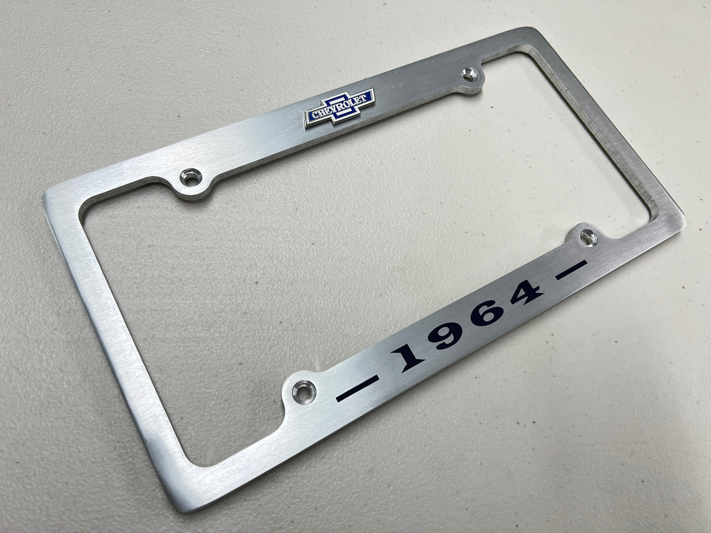 1964 CHEVROLET IMPALA, BEL AIR, BISCAYNE BRUSHED ALUMINUM LICENSE PLATE FRAME WITH BOWTIE LOGO